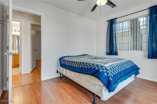 bedroom with hardwood / wood-style flooring and ceiling fan