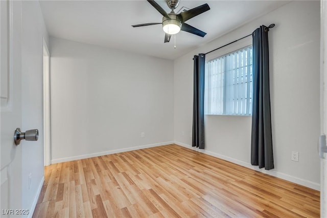 spare room featuring ceiling fan and light hardwood / wood-style floors