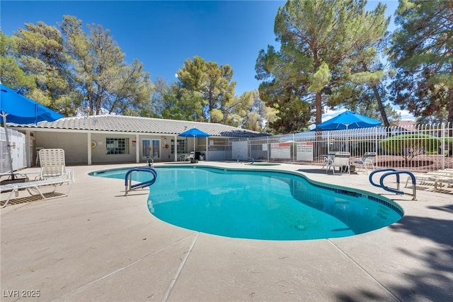 view of swimming pool featuring a patio area