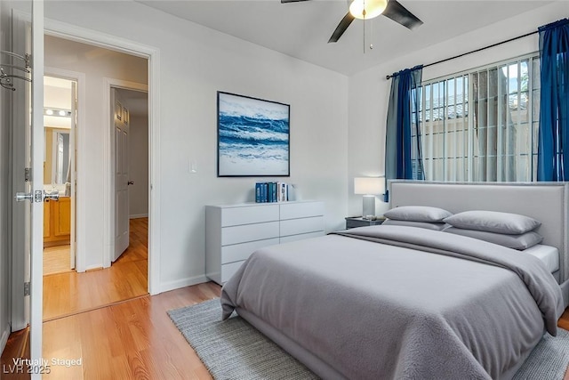 bedroom featuring ceiling fan and light wood-type flooring