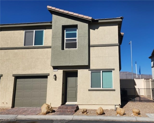 view of front of property with a garage