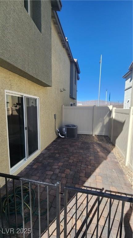 view of patio / terrace with central AC unit