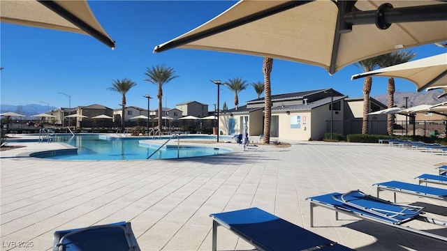 view of swimming pool with a patio and a jacuzzi