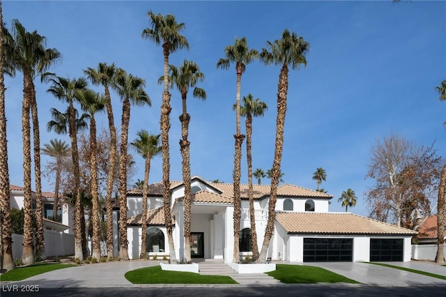 mediterranean / spanish-style house featuring a garage