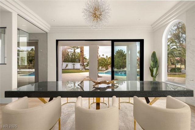 sunroom / solarium with an inviting chandelier