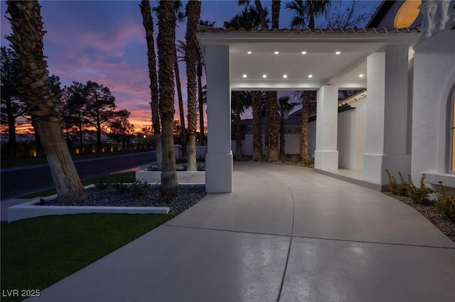 view of patio terrace at dusk