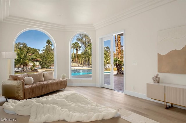 74 Innisbrook Ave, Las Vegas, NV 89113 - sitting room with radiator, baseboards, crown molding, and wood finished floors