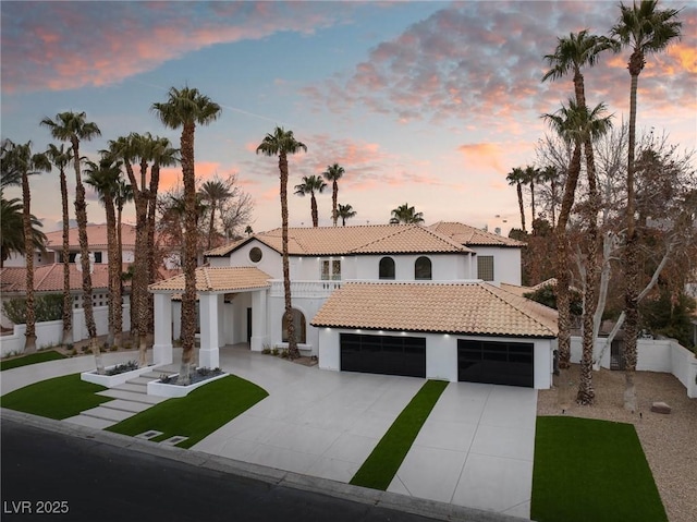 74 Innisbrook Ave, Las Vegas, NV 89113 - mediterranean / spanish-style house featuring fence, a tiled roof, stucco siding, driveway, and a front yard