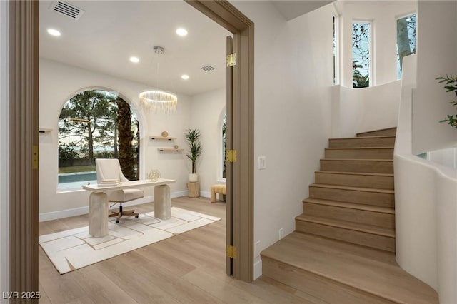 74 Innisbrook Ave, Las Vegas, NV 89113 - stairway featuring wood finished floors, visible vents, recessed lighting, and a notable chandelier