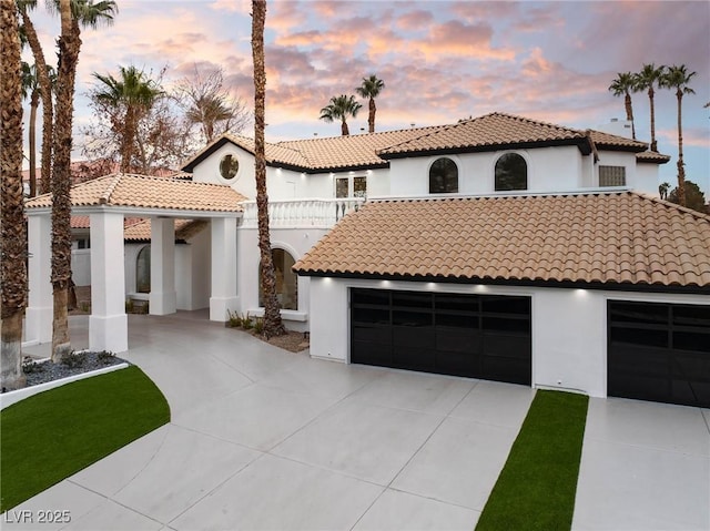 74 Innisbrook Ave, Las Vegas, NV 89113 - mediterranean / spanish home with concrete driveway, a tile roof, and stucco siding
