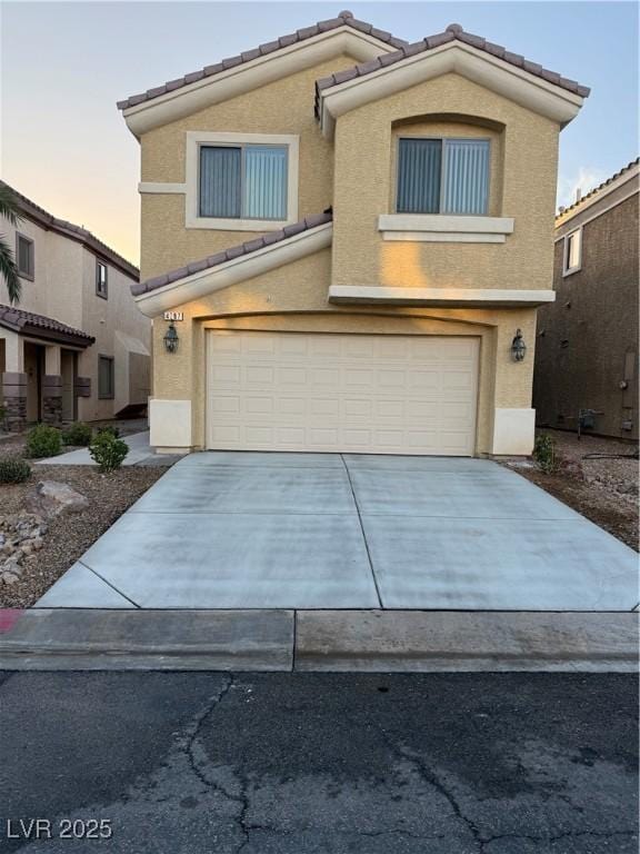 view of front of home with a garage