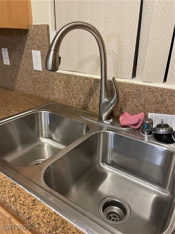 details with backsplash and a sink