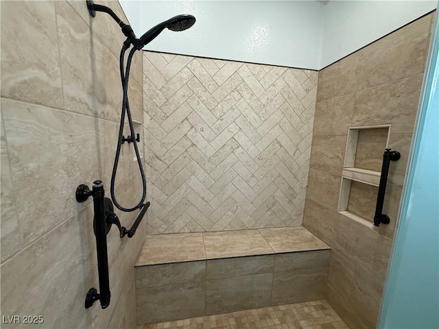 full bath with a tile shower