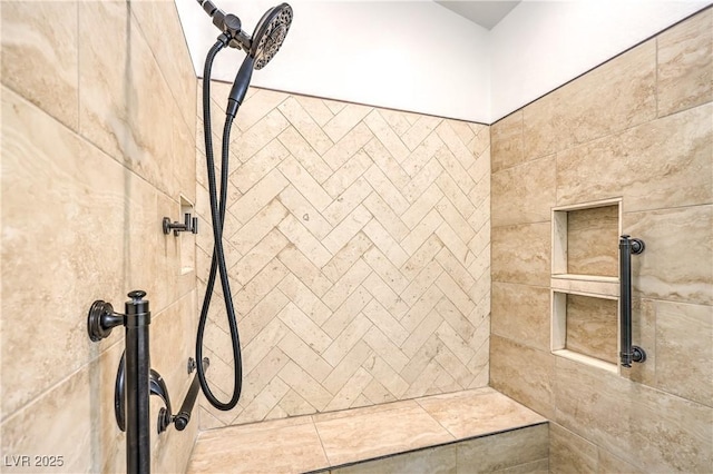 bathroom with tiled shower