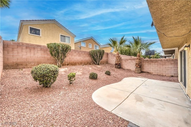 view of yard with a patio and a fenced backyard