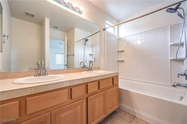 full bathroom with  shower combination, visible vents, and a sink