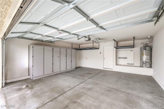 garage with a garage door opener, secured water heater, and baseboards