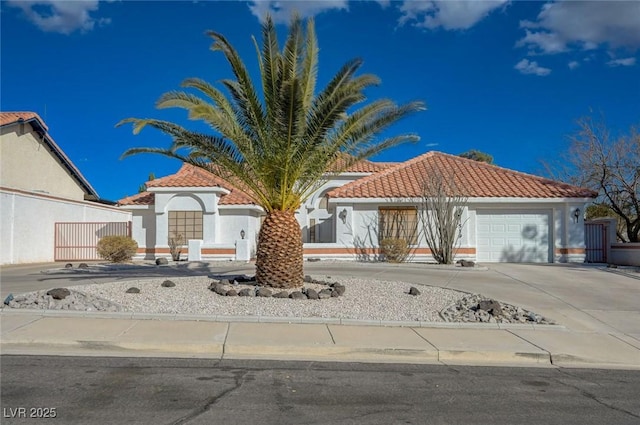 mediterranean / spanish house with a garage