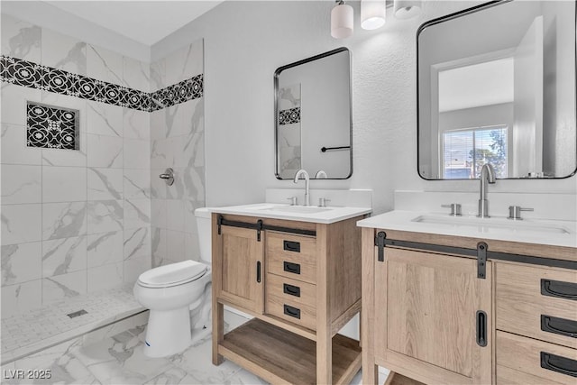 bathroom featuring toilet, marble finish floor, two vanities, and a sink