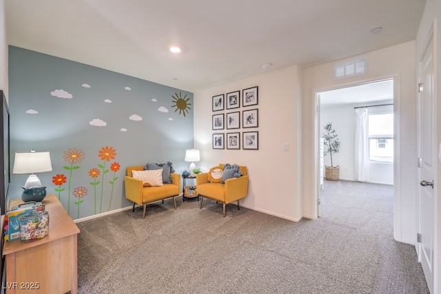 sitting room with carpet floors