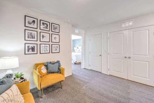 sitting room featuring carpet floors