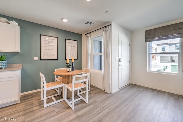 dining room with light hardwood / wood-style floors