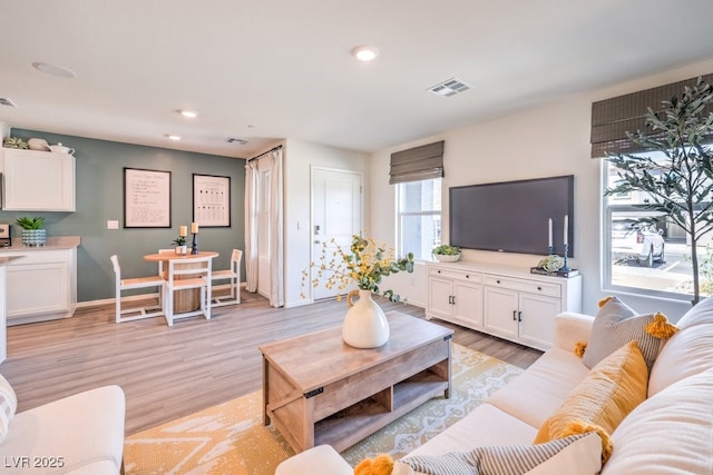 living room with light hardwood / wood-style flooring