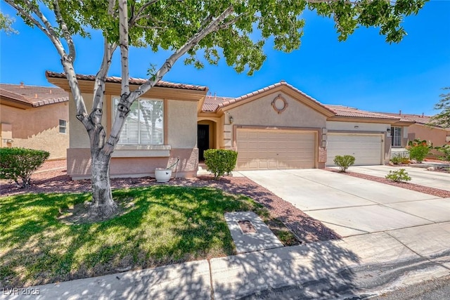 view of front of property with driveway, a garage, stucco siding, a tiled roof, and a front yard