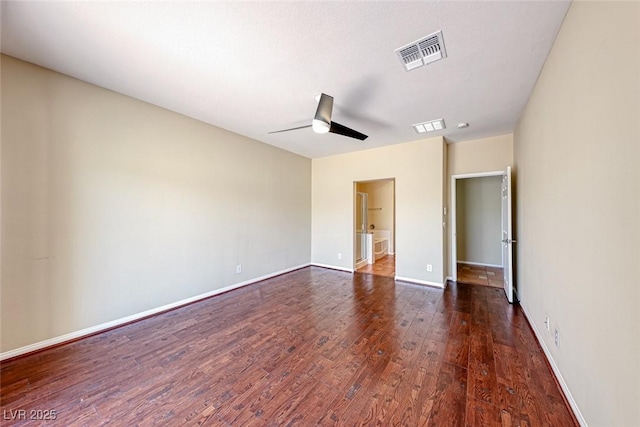 unfurnished bedroom with baseboards, visible vents, ceiling fan, and dark wood-style flooring