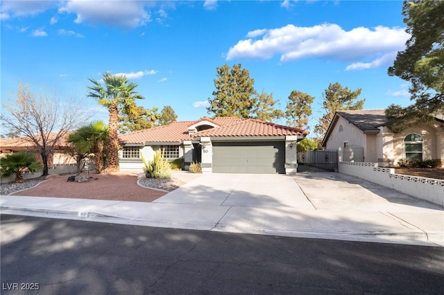 mediterranean / spanish home with a garage