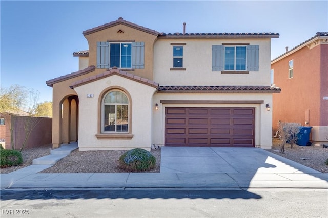 mediterranean / spanish-style house featuring a garage