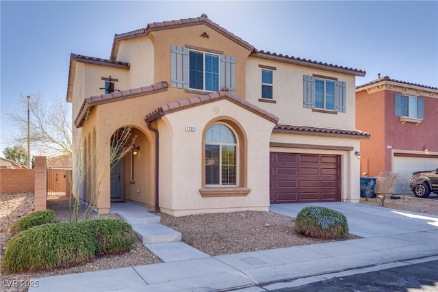 mediterranean / spanish-style house featuring a garage