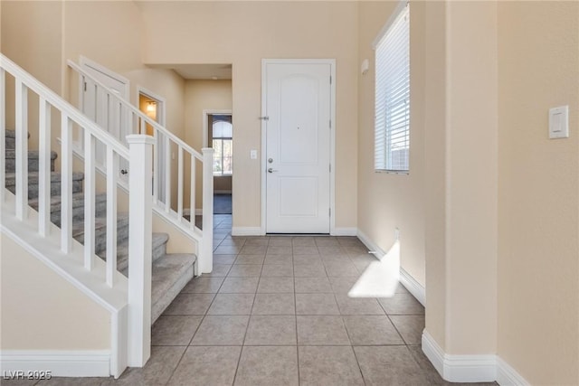 entryway featuring light tile patterned floors