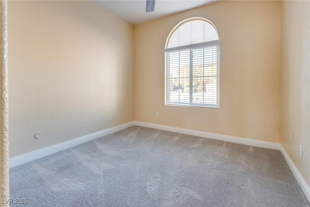 unfurnished room featuring carpet and ceiling fan