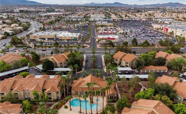 birds eye view of property featuring a mountain view