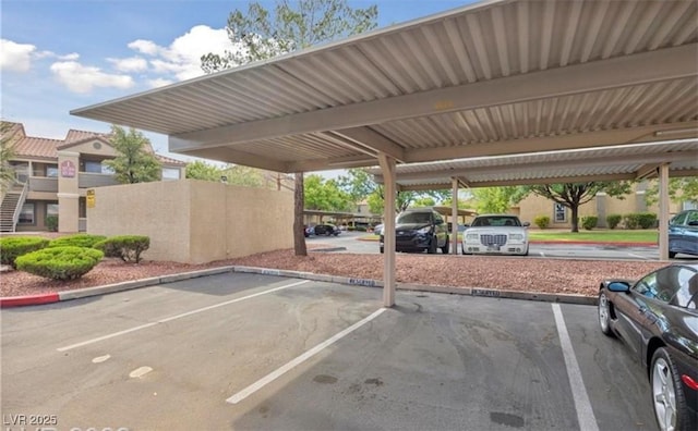 view of vehicle parking featuring a carport