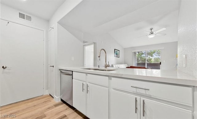 kitchen featuring sink, white cabinetry, light wood-type flooring, dishwasher, and ceiling fan