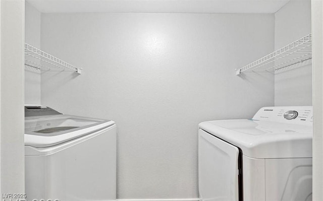 washroom featuring independent washer and dryer