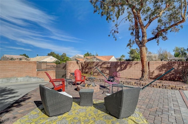 view of patio with a fire pit