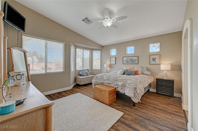 bedroom with ceiling fan, dark hardwood / wood-style floors, and vaulted ceiling