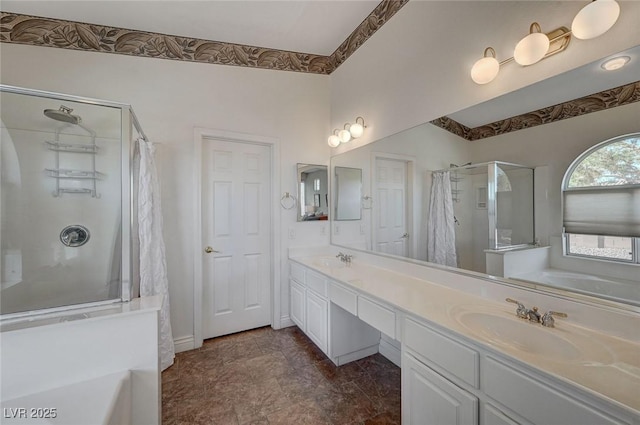 bathroom featuring vanity and independent shower and bath