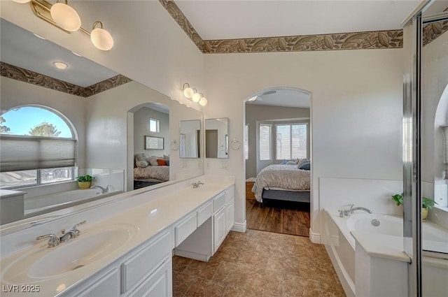 bathroom featuring vanity and a bathtub