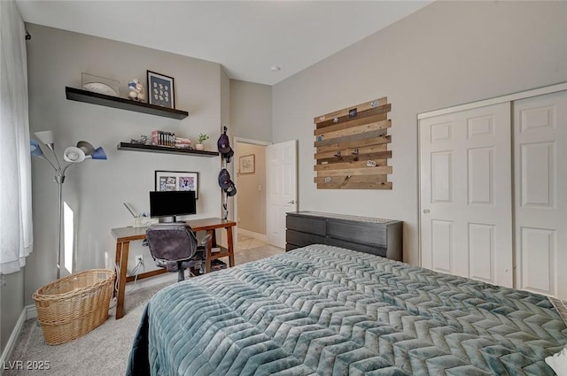 bedroom with light carpet and a closet