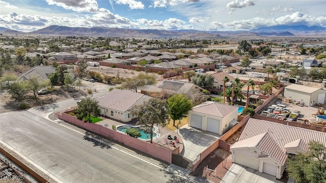 birds eye view of property with a mountain view