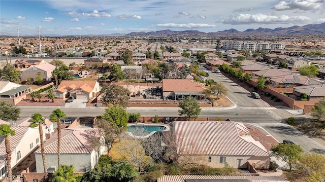 birds eye view of property featuring a mountain view