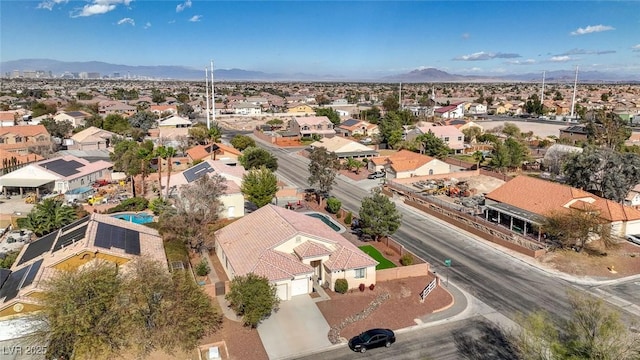 birds eye view of property featuring a mountain view