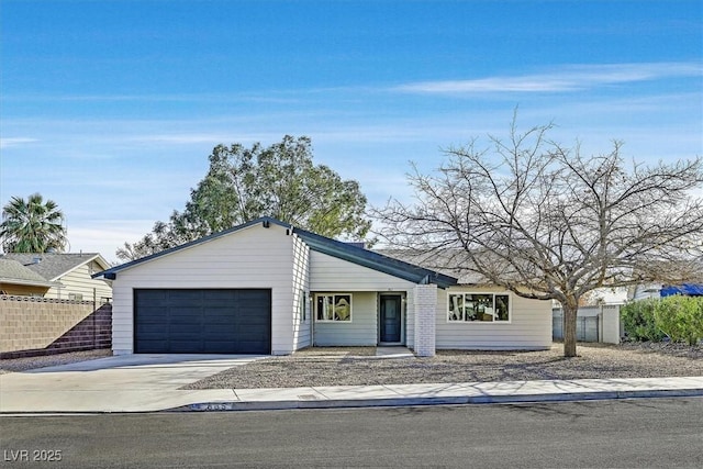 ranch-style home featuring a garage