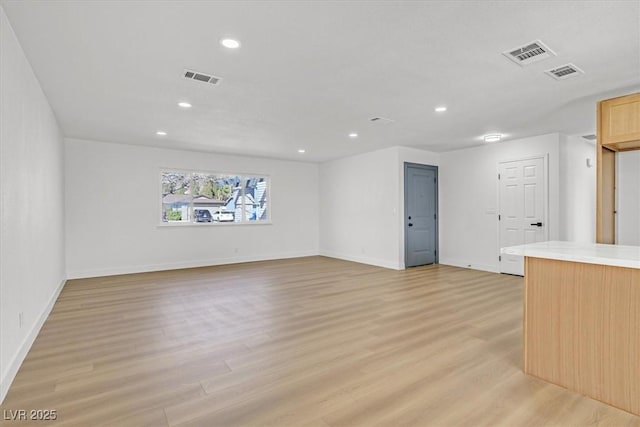 unfurnished living room with light hardwood / wood-style floors