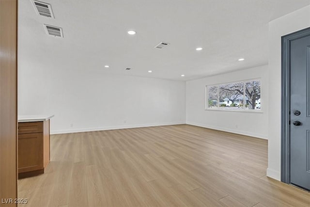 spare room featuring light wood-type flooring