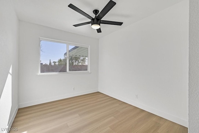 empty room with light hardwood / wood-style floors and ceiling fan